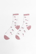 Medias largas crema con diseño de perros.