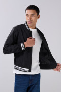 Chaqueta unicolor tipo bomber acolchada con rib con franjas