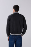 Chaqueta unicolor tipo bomber acolchada con rib con franjas