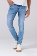 Jean azul claro skinny con desgastes ligeros y tiro bajo