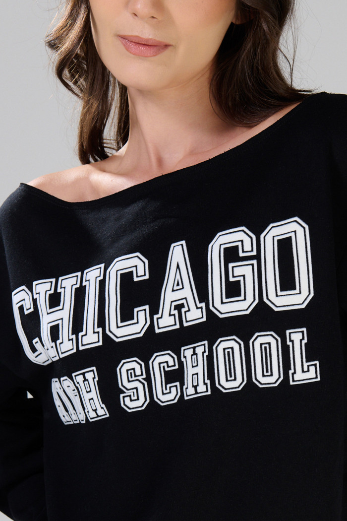 Buzo negro cuello redondo oversize con arte college
