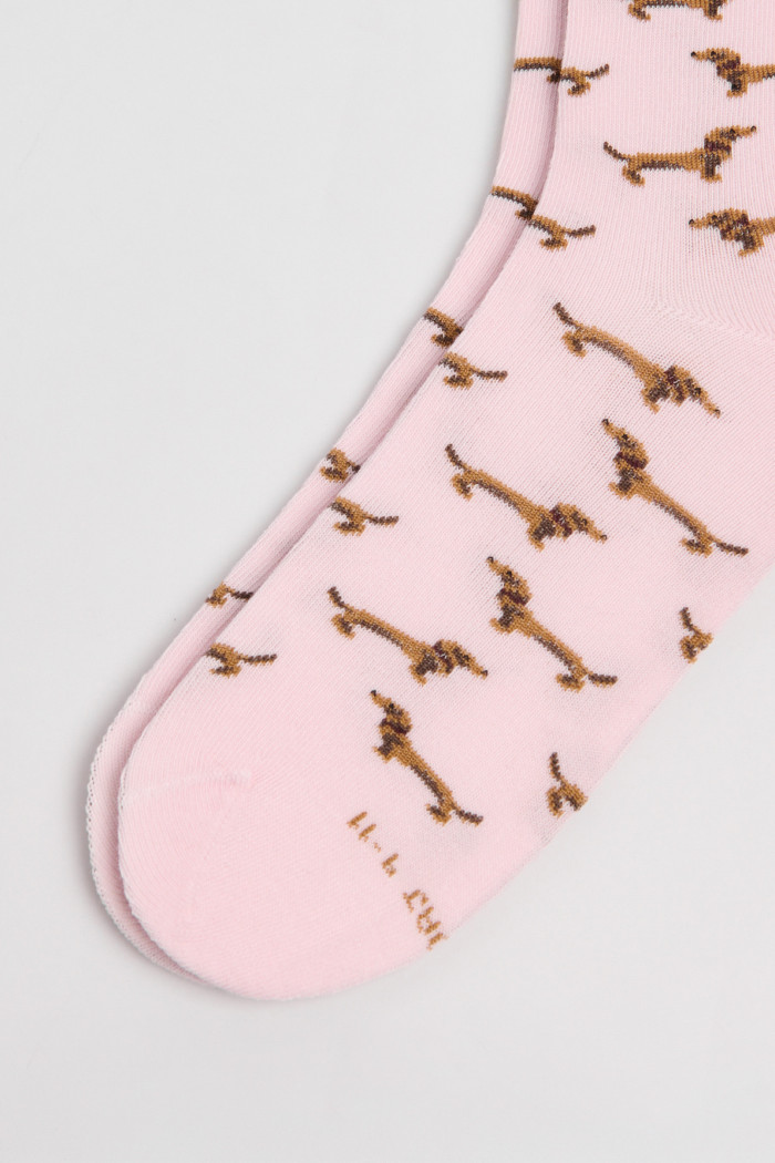Medias rosadas largas con diseños de perritos salchicha