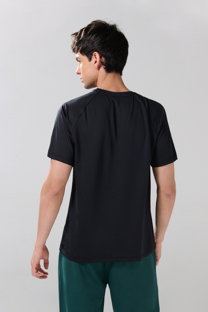 Camiseta unicolor cuello redondo con manga ranglan corta