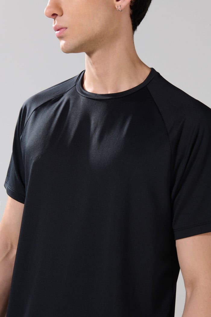 Camiseta unicolor cuello redondo con manga ranglan corta