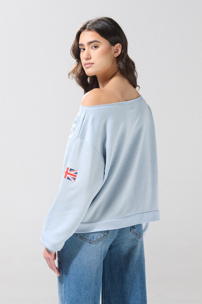 Buzo azul claro oversize college cuello redondo