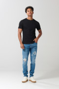 Jean slim tiro bajo azul medio con rotos y ajuste ceñido