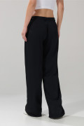Pantalón tiro medio palazzo negro con bota ancha