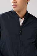 Chaqueta unicolor acolchada bomber con bolsillos