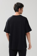Camiseta oversize unicolor manga corta con hombro caído