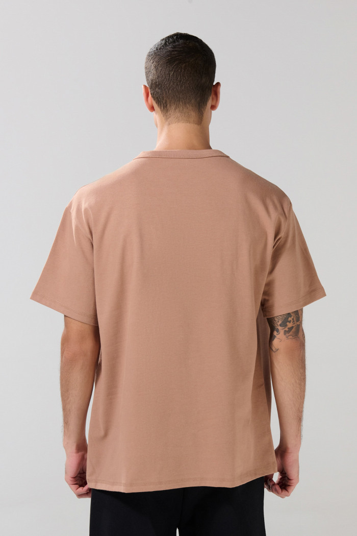 Camiseta oversize unicolor manga corta con hombro caído