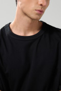 Camiseta oversize unicolor manga corta con hombro caído