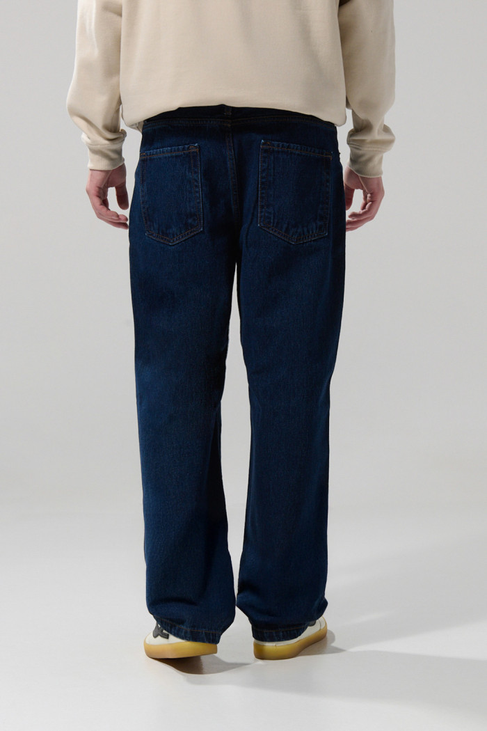 Jean tiro medio azul oscuro baggy con bota ancha