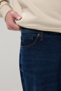 Jean tiro medio azul oscuro baggy con bota ancha