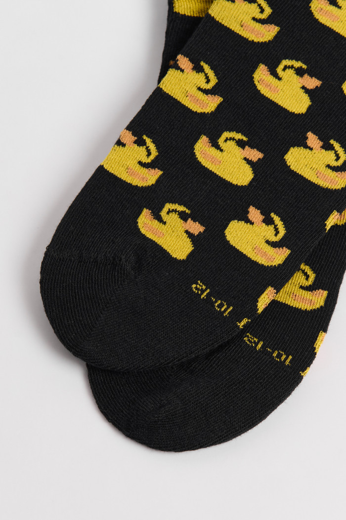 Medias tobilleras unicolores con patos amarillos