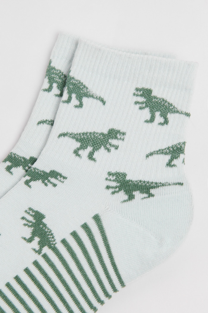 Medias cortas unicolores con rayas y arte de dinosaurios