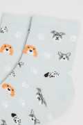 Medias cortas unicolores con diseños de perritos y huellas
