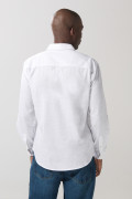 Camisa unicolor manga larga con texturas y bolsillo
