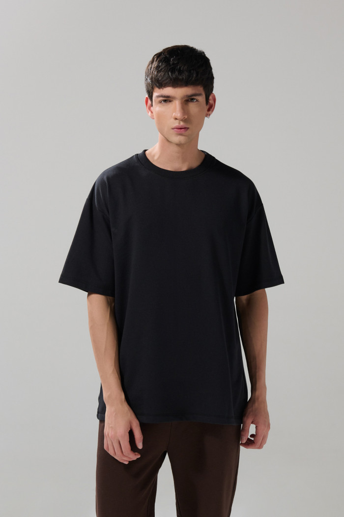 Camiseta en algodón pesado unicolor manga corta oversize