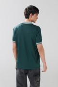 Camiseta polo unicolor manga corta con botones en frente