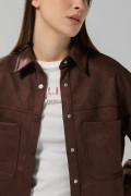 Blusa unicolor oversize manga larga en tela suede
