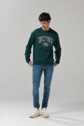 Jean skinny ajustado azul medio con tiro bajo y desgastes