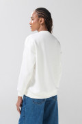 Buzo cuello redondo crema oversize de Lilo y Stitch
