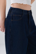 Jean baggy tiro medio azul intenso con bota ancha
