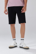Bermuda negra de jean slim tiro bajo con bolsillos
