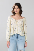 Blusa estampada crema con manga larga y escote V

