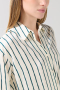 Blusa en satín unicolor manga larga con botones y estampados
