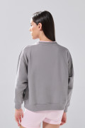 Buzo cuello redondo infaltables unicolor con hombro rodado
