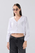 Blusa manga larga blanca con diseños de encaje