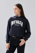 Buzo azul intenso college oversize perchado con capota
