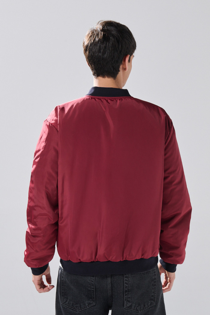 Chaqueta doble faz bomber acolchada unicolor con bolsillos
