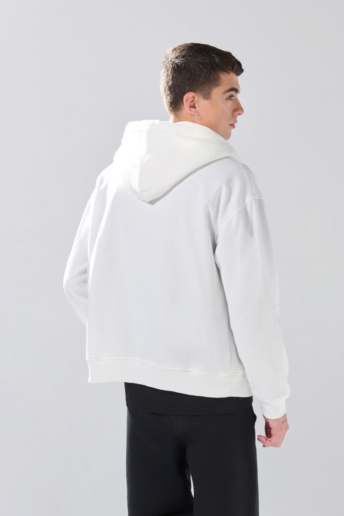Buzo oversize unicolor con cremallera, cordón y capota