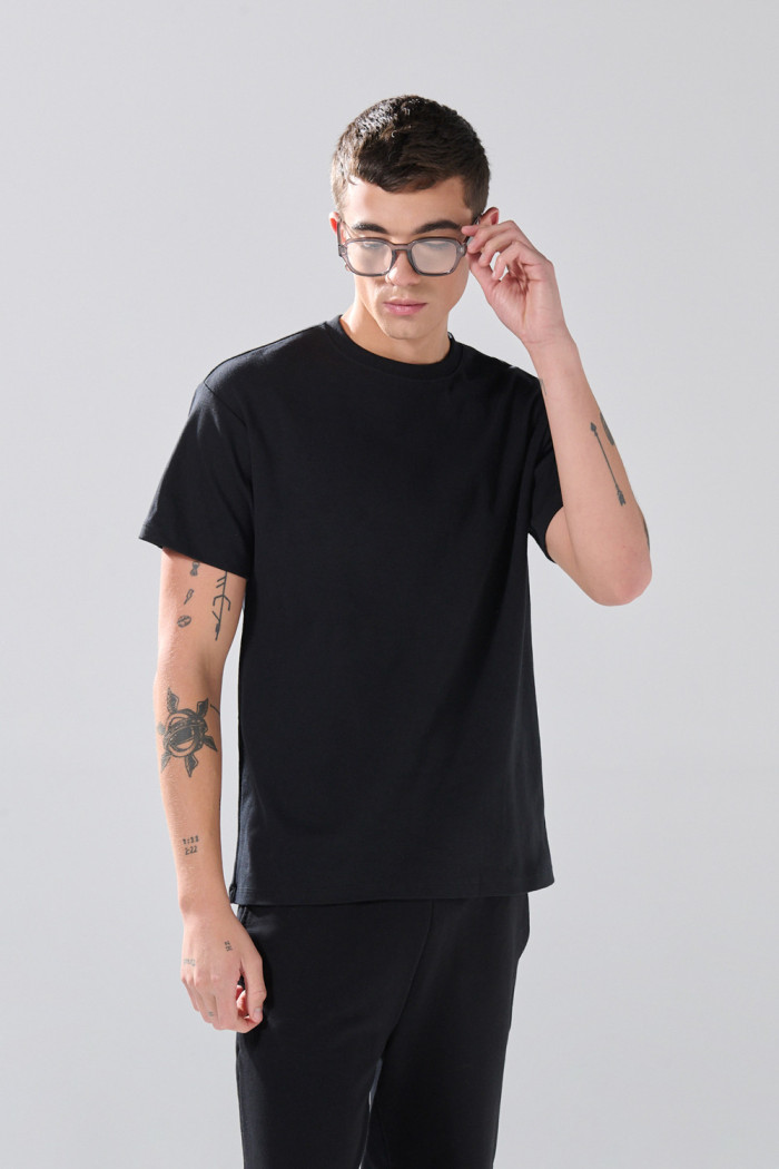 Camiseta en algodón hombro rodado unicolor manga corta
