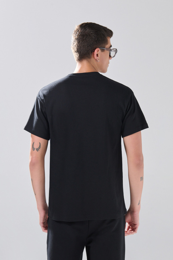 Camiseta en algodón hombro rodado unicolor manga corta