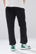 Pantalón unicolor tipo jogger con bolsillos laterales