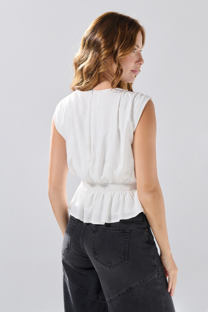 Blusa  manga corta con cremallera en espalda