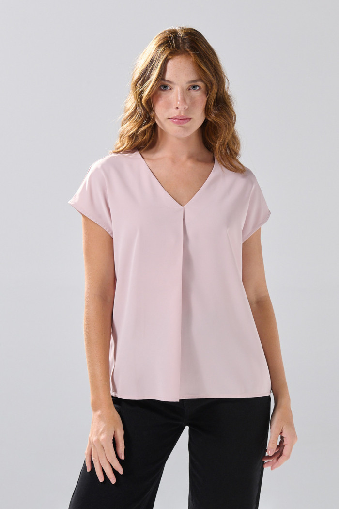 Blusa unicolor con hombro rodado y escote V