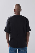 Camiseta unicolor oversize manga corta con texturas sutiles
