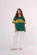Camiseta oversize cuello V verde college de Fan Edition
