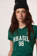 Camiseta cuello polo verde con arte college de Fan Edition
