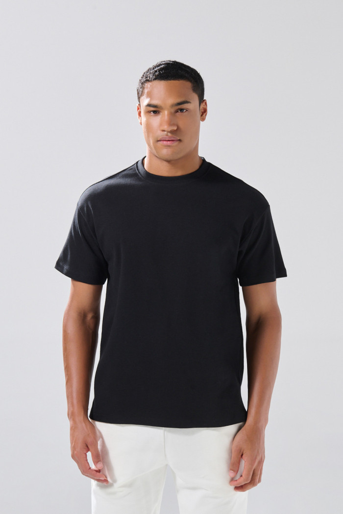 Camiseta en algodón holgada unicolor con manga corta
