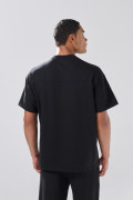 Camiseta oversize unicolor en tela pesada con manga corta
