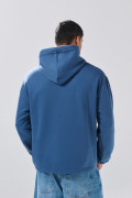 Buzo oversize azul oscuro con arte college y capota

