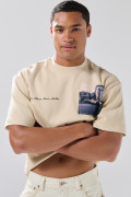 Camiseta oversize cuello redondo unicolor con arte de Poetry
