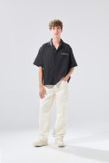 Jean loose crema de Poetry con tiro bajo y bota ancha