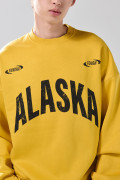 Buzo oversize cuello redondo amarillo con artes college
