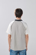 Camiseta polo oversize gris con arte college y manga ranglan
